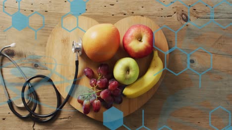 Animation-of-chemical-structures-over-stethoscope-and-fruit
