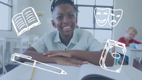 Animation-of-literature-icons-over-happy-smiling-african-american-schoolboy-at-desk-in-class