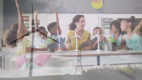 Animation-of-windmill-in-field-over-happy-diverse-female-teacher-and-pupils-with-windmills-in-class