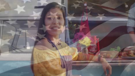 Animation-of-flag-of-usa-over-happy-biracial-couple-at-food-truck