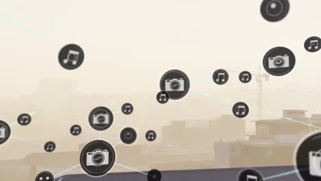 Animation-of-icons-connected-with-lines-over-fog-covered-city-against-sky