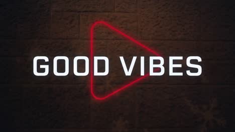 Animation-of-good-vibes-text-banner-over-neon-play-icon-against-red-brick-wall-background