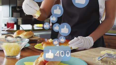 Animation-of-thumbs-up-icons-and-changing-numbers-over-midsection-of-chef-garnishing-hotdog