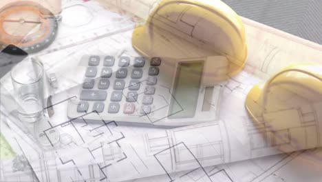 Animation-of-calculator-and-helmet-over-house-plans