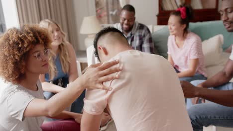 Diverse-friends-talking-and-crying-at-group-therapy,-slow-motion
