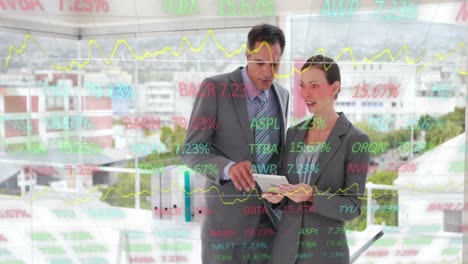 Animation-of-data-processing-over-caucasian-businessman-and-businesswoman-using-digital-tablet