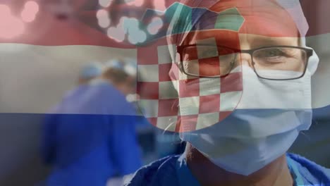 Animation-of-waving-croatia-flag-over-portrait-of-caucasian-male-surgeon-at-hospital