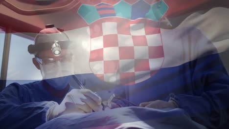 Animation-of-waving-croatia-flag-over-male-and-female-surgeon-performing-surgery-at-hospital
