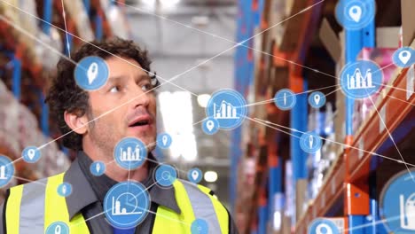 Animation-of-network-of-digital-icons-over-caucasian-male-worker-checking-stock-at-warehouse