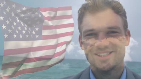 Animation-of-happy-caucasian-man-by-sea-over-flag-of-usa