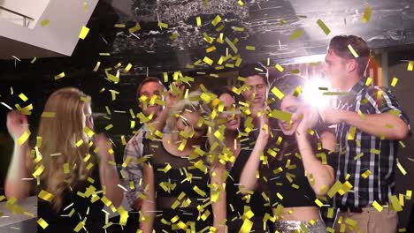 Animation-of-confetti-falling-over-diverse-friends-dancing