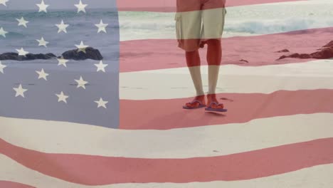 Animation-of-african-american-man-by-sea-over-flag-of-usa