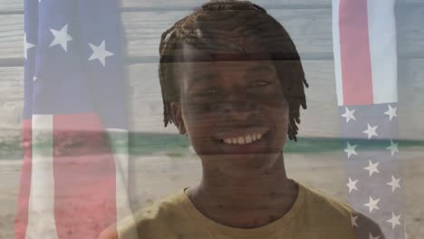 Animation-of-happy-african-american-man-by-sea-over-flag-of-usa