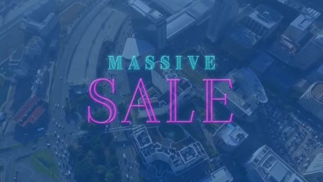 Animation-of-neon-massive-sale-text-banner-against-aerial-view-of-cityscape