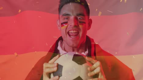 Animation-Von-Konfetti,-Das-über-Einen-Kaukasischen-Fußballspieler-Fällt,-Der-Mit-Deutscher-Flagge-Feiert