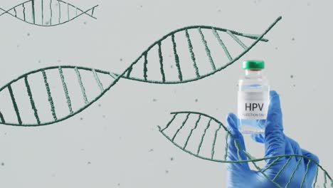 Animation-Von-DNA-Strängen,-Die-Sich-über-Die-Hand-Eines-Arztes-Bewegen,-Der-Den-HPV-Impfstoff-Auf-Grauem-Hintergrund-Hält