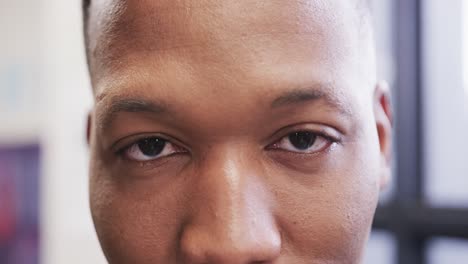 Close-up-portrait-of-happy-african-american-male-creative-at-casual-office,-in-slow-motion
