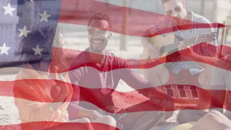 Animation-of-waving-flag-of-america-over-happy-diverse-friends-socialising-on-sunny-beach