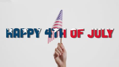 Animation-of-happy-4th-of-july-text-and-hand-holding-flag-of-america-on-white-background