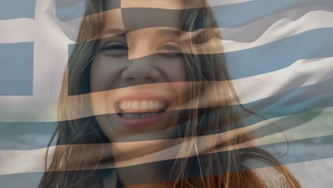 Animation-of-waving-flag-of-greece-over-close-up-portrait-of-biracial-woman-against-sea