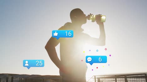 Animation-of-social-media-icons-and-numbers-over-african-american-male-athlete-drinking-water