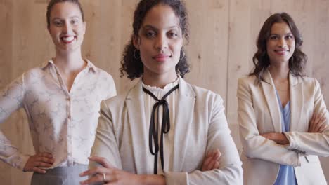 Portrait-of-happy-diverse-female-colleagues-in-office-foyer,-slow-motion