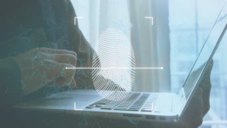 Animation-of-fingerprint-and-connected-dots-over-midsection-of-caucasian-man-using-laptop