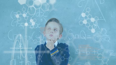 Animation-of-dna-strand-diagrams-and-data-processing-over-caucasian-schoolboy-at-chalkboard