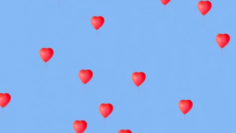 Animation-of-red-dots-over-red-heart-shape-balloons-against-blue-background