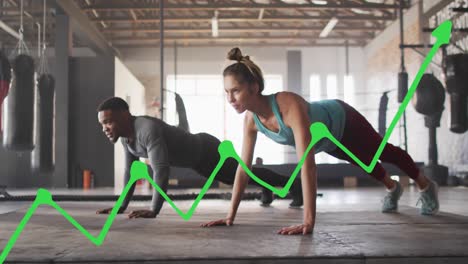 Animation-of-data-processing-over-diverse-man-and-woman-doing-push-ups,-exercising-in-boxing-gym