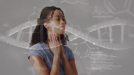Animation-of-dna-strand-diagrams-with-data-processing-over-biracial-woman-holding-neck