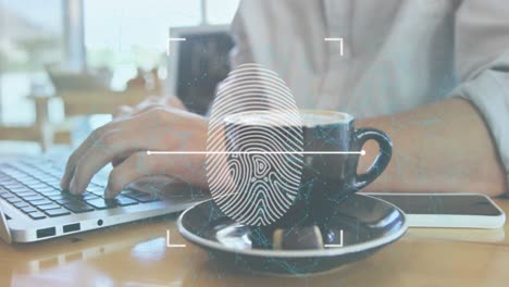 Animation-of-fingerprint,-connected-dots,-midsection-of-caucasian-man-with-coffee-working-on-laptop