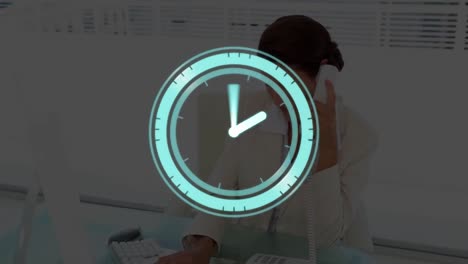 Animation-of-digital-clock-over-caucasian-woman-talking-on-phone-and-working-on-computer-in-office