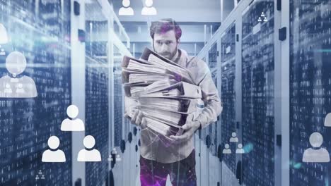 Animation-of-profile-icons-floating-over-caucasian-man-carrying-files-against-computer-server-room