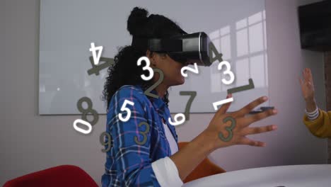 Animation-of-changing-numbers-over-african-american-woman-using-vr-headset