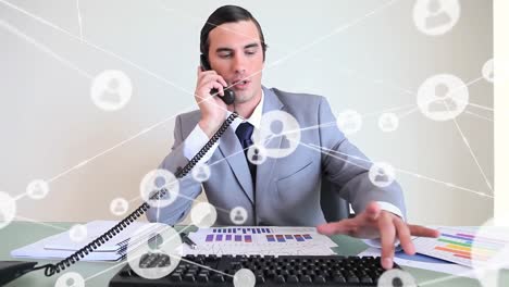 Animation-of-financial-data-processing-over-caucasian-businessman-on-phone