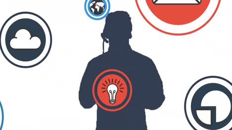 Composition-of-social-media-icons-and-data-over-man's-silhouette-using-phone-headset