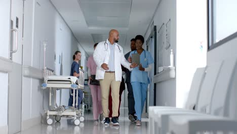 Diverse-doctors-working-together-at-hospital,-slow-motion