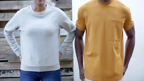 African-american-woman-in-grey-sweatshirt-and-man-in-yellow-t-shirt,-slow-motion,-copy-space