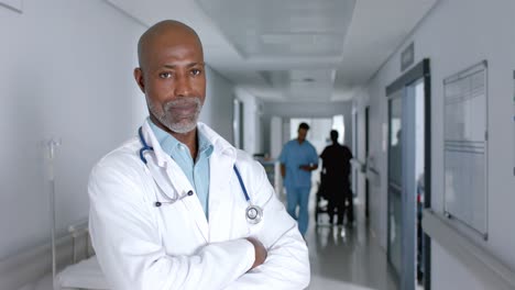 Portrait-of-happy-african-american-male-doctor-wearing-lab-coat-and-stethoscope,-slow-motion