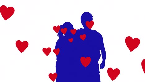Animation-of-hearts-falling-over-silhouette-of-couple-embracing