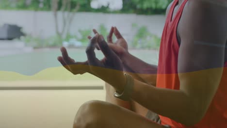 Animation-Der-Flagge-Deutschlands-über-Einem-Afroamerikanischen-Mann-Beim-Meditieren