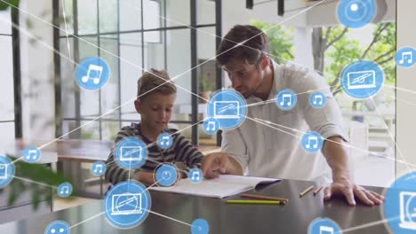 Animation-of-network-of-connections-with-icons-over-caucasian-man-with-son-doing-homework