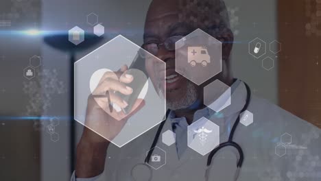 Animation-Medizinischer-Symbole-Und-Datenverarbeitung-über-Einem-Afroamerikanischen-Männlichen-Arzt