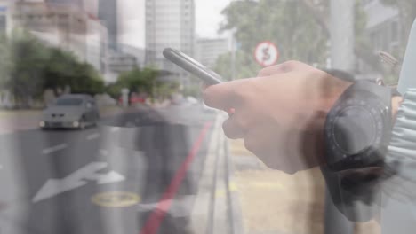 Animation-of-caucasian-man-using-smartphone-over-people-walking-and-cityscape