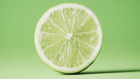 Video-of-sliced-lime-with-copy-space-over-green-background
