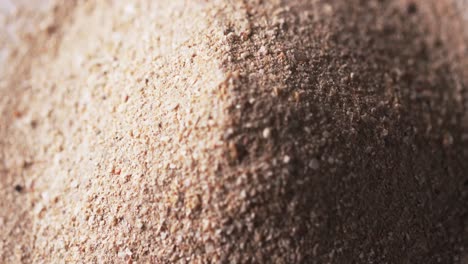 Video-of-close-up-of-sand-grains-and-copy-space-background