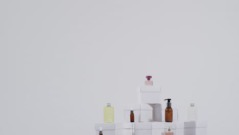 Video-of-beauty-products-with-white-cardboard-boxes-with-copy-space-over-white-background