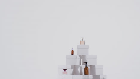 Video-of-beauty-products-with-white-cardboard-boxes-with-copy-space-over-white-background