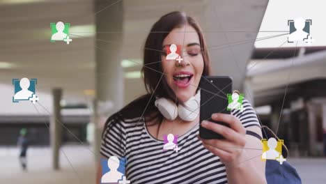 Animation-of-network-of-connections-with-icons-over-caucasian-woman-with-smartphone